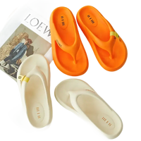 Orange and white flip-flops.