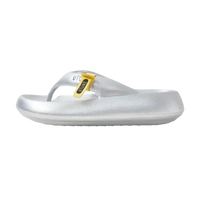 Silver flip-flop sandal with yellow accent.