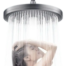 Overhead shower head with water.