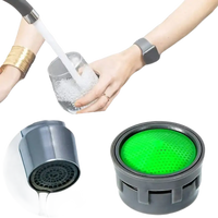 Faucet aerator and flow restrictor.