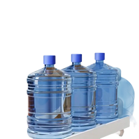 Three water jugs on a cart.