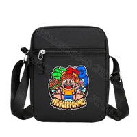 Black crossbody bag with cartoon graphic.