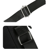 Black bag strap with metal hardware.