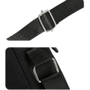 Black bag strap with metal hardware.
