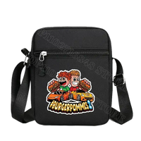 Black shoulder bag with cartoon graphic.