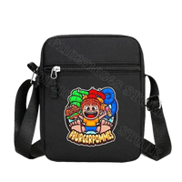Black messenger bag with cartoon graphic.