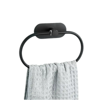 Black oval towel ring with gray towel.