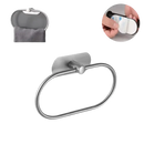 Oval stainless steel towel ring with adhesive mount.