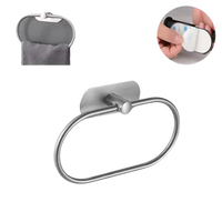 Oval stainless steel towel ring with adhesive mount.