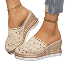 Beige lace wedge mules.