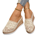 Beige lace wedge mules.