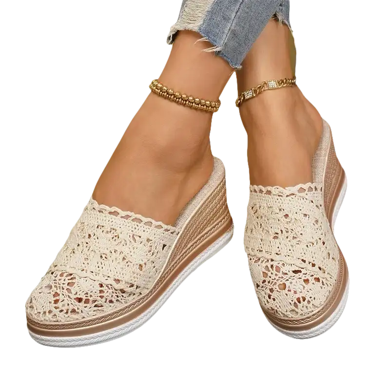 Beige lace wedge mules.