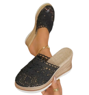 Black lace wedge mule.