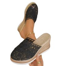 Black lace wedge mule.
