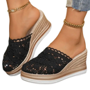 Black crochet wedge mules.