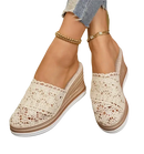 Lace-covered wedge mules.