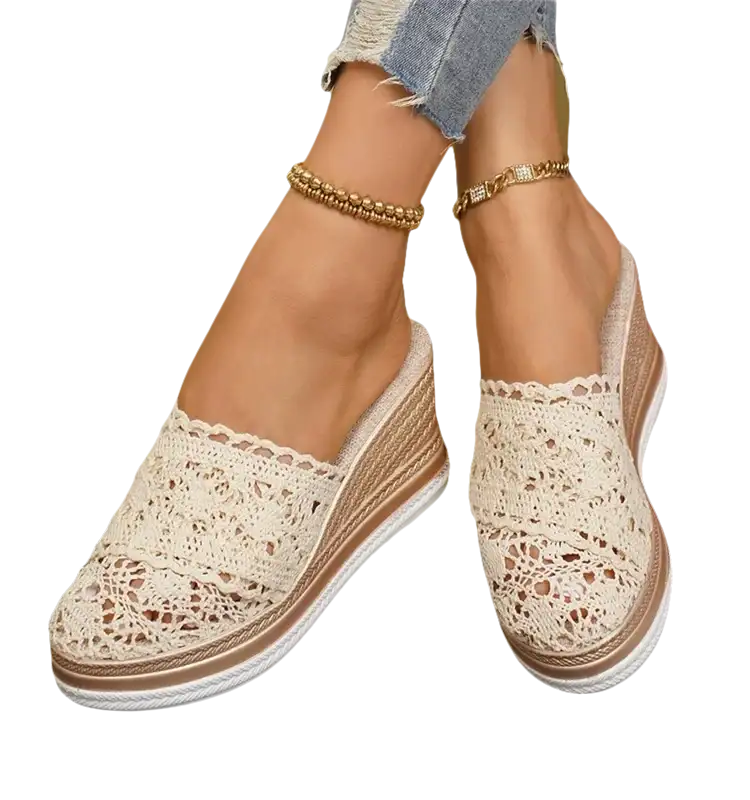 Lace-covered wedge mules.