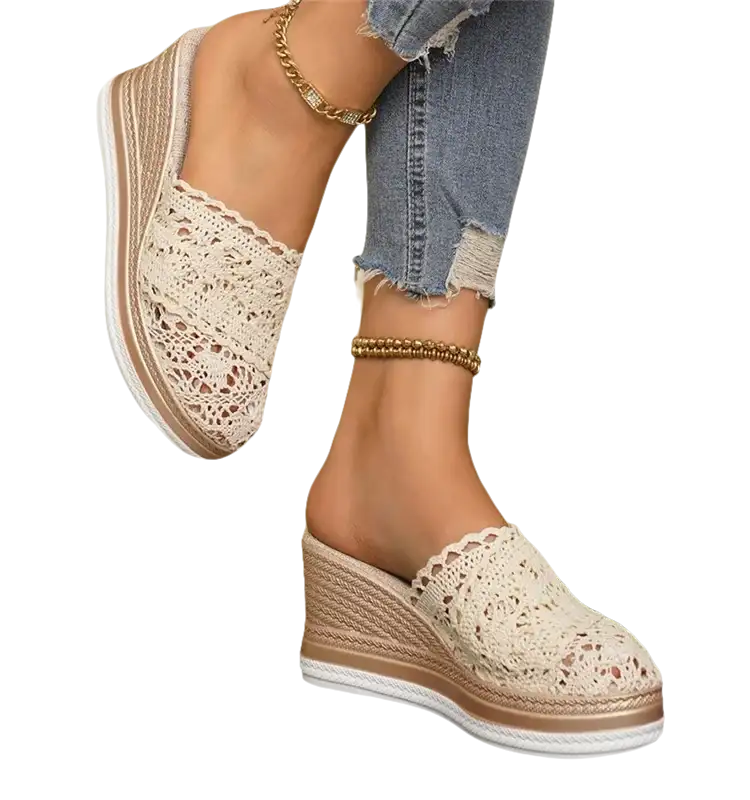 Lace-covered wedge mule shoes.