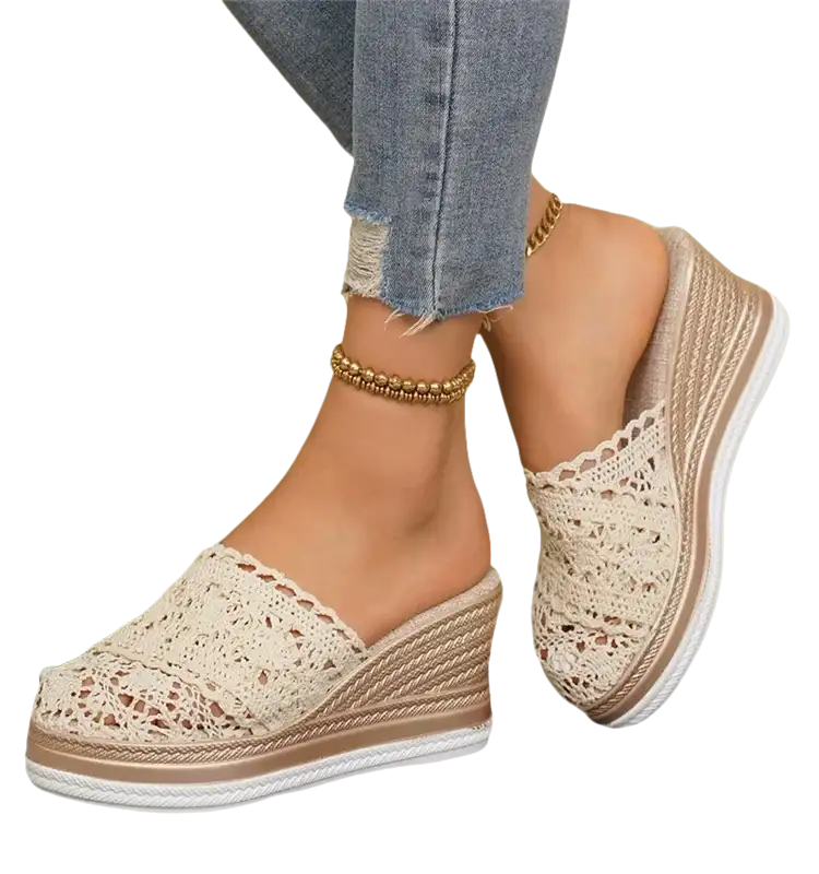 Lace-covered wedge mule shoes.