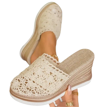 Lace-covered wedge sandals.