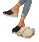 Wedge-heeled crochet mules.