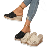 Wedge-heeled crochet mules.
