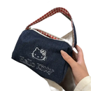 Denim Hello Kitty handbag with gingham handle.