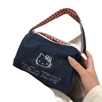 Denim Hello Kitty handbag with gingham handle.