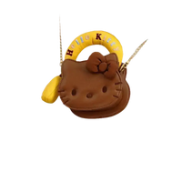 Brown Hello Kitty purse with yellow handle.