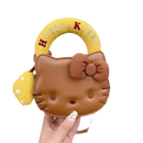 Brown Hello Kitty purse with yellow handle.