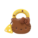 Brown Hello Kitty purse with yellow handle and mushroom charm.