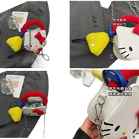 Hello Kitty purse with yellow charm.