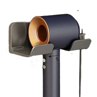 Wall-mounted hair dryer holder with dimensions.