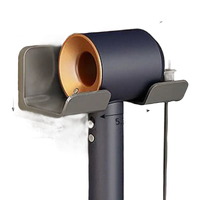Wall-mounted hair dryer holder.