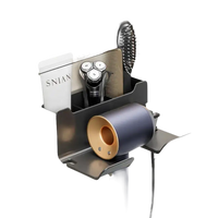 Wall-mounted hair dryer and accessories organizer.