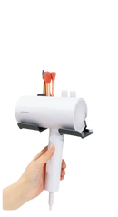 Wall-mounted hair dryer holder.