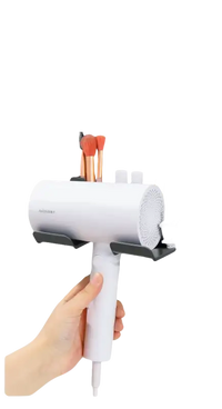 Wall-mounted hair dryer holder.