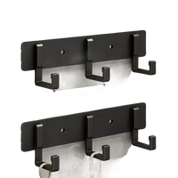 Black three-hook wall rack.