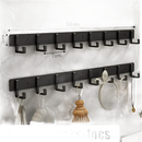 Black wall-mounted coat rack with eight hooks.