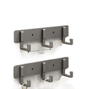 Silver-colored, three-hook wall rack.