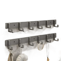 Silver-colored, six-hook wall racks.