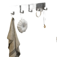 Gray wall-mounted folding hook rack.