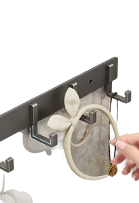 Wall-mounted metal hook rack.
