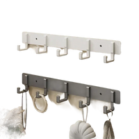 Wall-mounted coat racks with hooks.