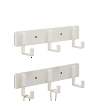 White three-hook wall rack.