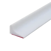 White, adhesive-backed, quarter-round molding.