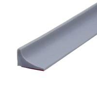 Gray, flexible, adhesive-backed shower threshold.