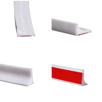 White adhesive shower water barrier.