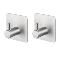Two brushed metal adhesive hooks.