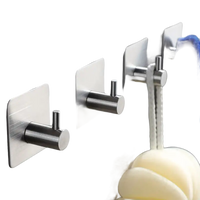 Adhesive metal wall hooks.
